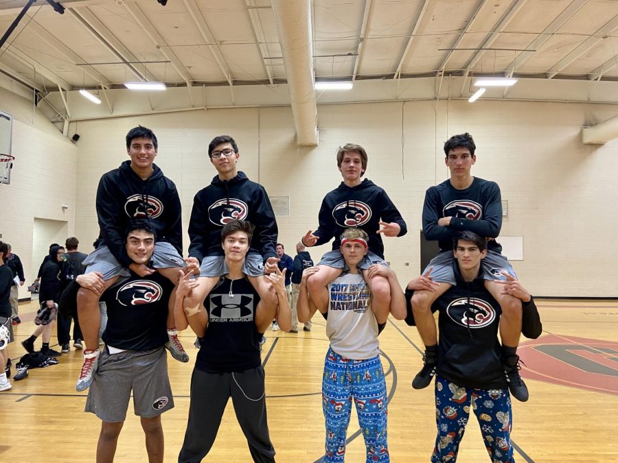 Left to right: Marlon Morales, Brandon Morales, Christian Gilbert, Michael Gilbert, Jayson Jacoby, Brandon Jacoby, Zachary Preciado, and Nicholas Preciado pose after wrestling Myrtle Beach High School. Not pictured: Dominic Gilbert