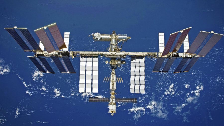 The+International+Space+Station+floating+above+Earth